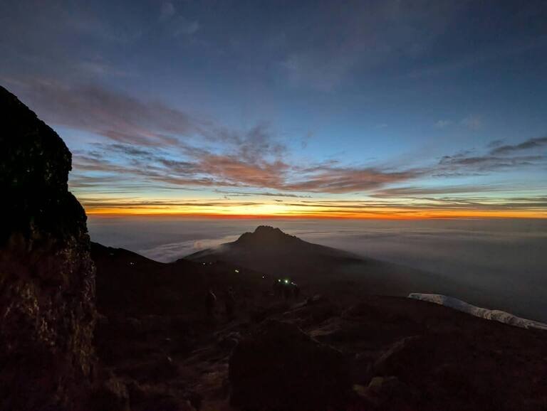 Colourful sunrise above the clouds on Mount Kilimanjaro.